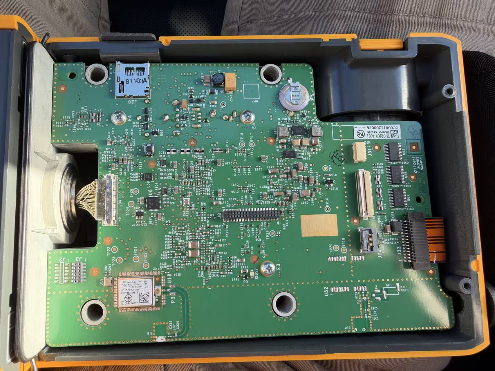 Main board, back-cover side, in the case: the Wi-Fi and Bluetooth module bottom left with its antenna, the cable to the infrared engine on the left, the microSD socket top left, the screen connector and its three level shifters on the right.